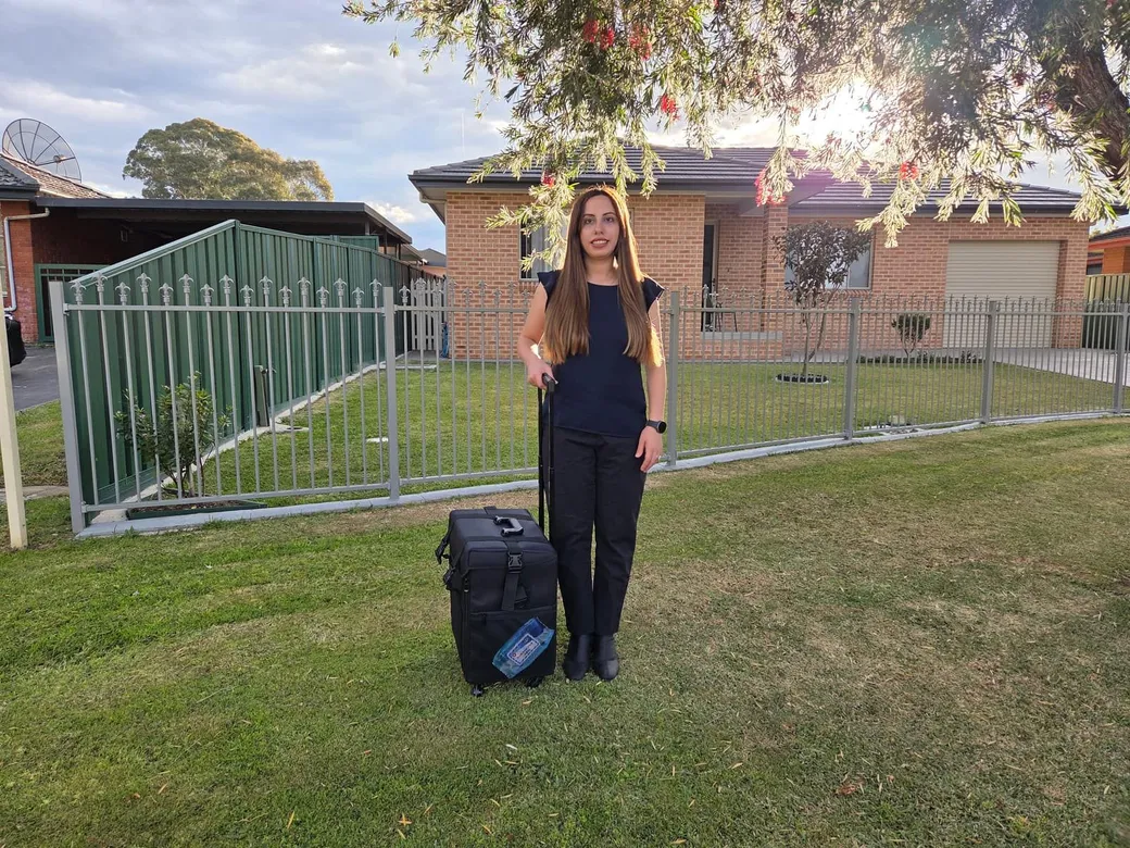 Madleen with her mobile podiatry case outside a Sydney home
